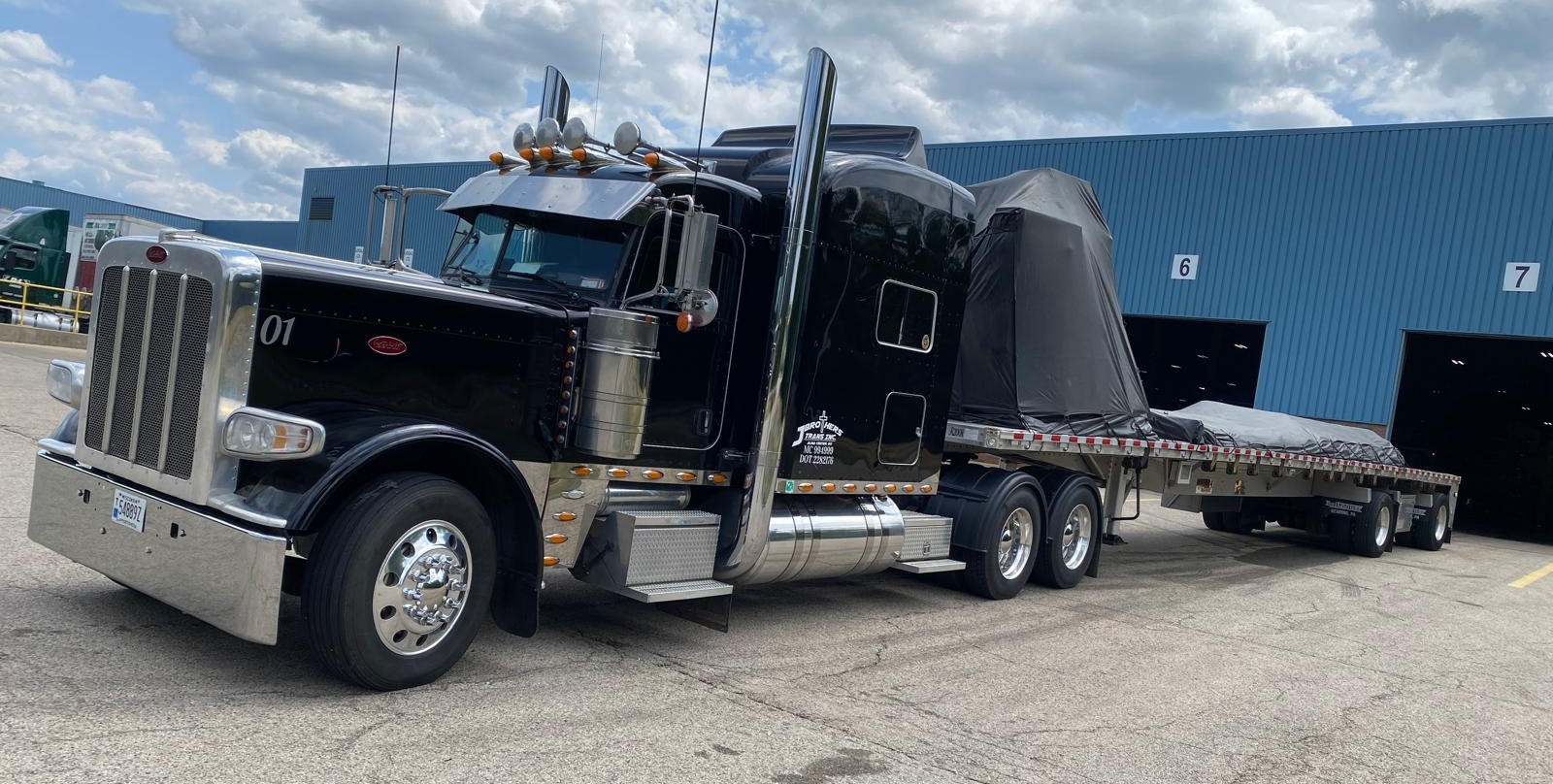 Black Peterbilt with cargo